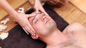man-enjoying-face-massage