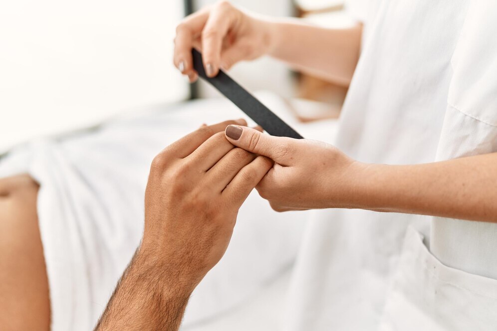 young-hispanic-man-relaxed-having-manicure